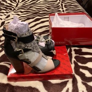 Guess shoes, black with snakeskin front , back zipper for easy wear .